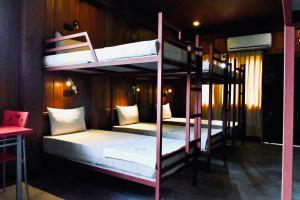 Postel nebo postele na pokoji v ubytování The Green Hostel