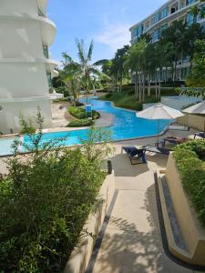 a swimming pool at a hotel with a resort at HomeAwayFromHome in Phuket