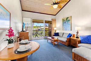 a living room with a couch and a table at Napili Shores H263 in Kapalua