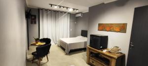 Et tv og/eller underholdning på Portal suítes Avenida Paraty + 26 billeder