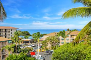 a view of a city with palm trees and the ocean at Maui Vista 3403 in Kihei