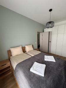 Ένα ή περισσότερα κρεβάτια σε δωμάτιο στο Apartament Baltic Breeze