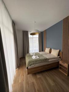 Ένα ή περισσότερα κρεβάτια σε δωμάτιο στο Apartament Baltic Breeze