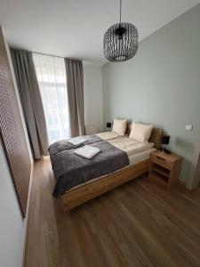 Ένα ή περισσότερα κρεβάτια σε δωμάτιο στο Apartament Baltic Breeze