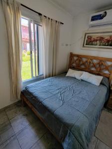 Ένα ή περισσότερα κρεβάτια σε δωμάτιο στο Apartamento Parque Necochea