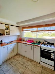 Η κουζίνα ή μικρή κουζίνα στο Apartamento Parque Necochea