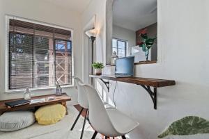 a room with a desk with a laptop and a chair at 1BR Near UofA, Work Desk, Gem Show Friendly in Tucson +26 photos