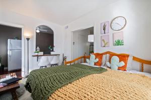 a bedroom with a large bed with stuffed animals on it at 1BR Near UofA, Work Desk, Gem Show Friendly in Tucson
