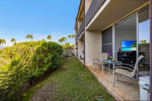 a patio with a view of the ocean from a house at Napili Ridge K6 in Napili-Honokowai