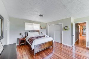 a bedroom with a large bed and a wooden floor at Redwing Farm Cottage - Mountain Views and Firepit! in Bedford +44 photos