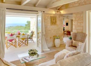 a living room with a couch and a table at Kallista House in Kourtaíïka