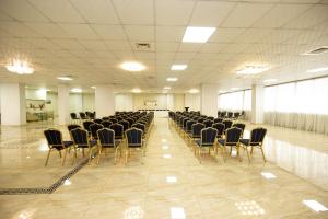 a large room with chairs and a room with at Howard Johnson Ciudad del Este in Ciudad del Este +81 photos