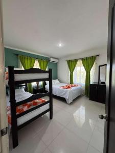 Una cama o camas en una habitación de Yopo Resort