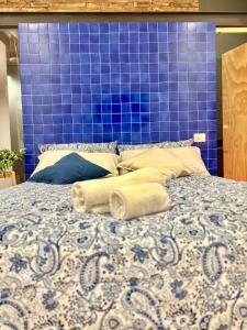 Кровать или кровати в номере Petit Marchè