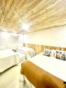 Ένα ή περισσότερα κρεβάτια σε δωμάτιο στο Villa da Praia -Orla de Atalaia