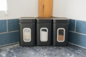 three trash cans sitting next to a wall at Contractors-Relocation-Free Parking-M5 Junction2 in Oldbury