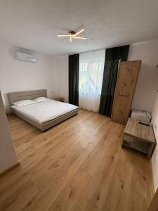 En eller flere senge i et værelse på Carolina Residence