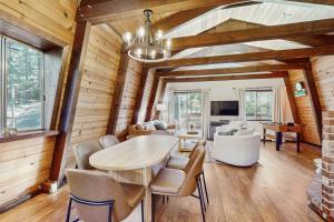 a dining room with a table and chairs at Charming Cabin in Bijou