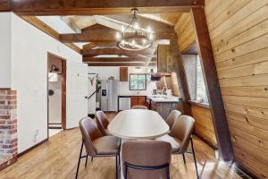 a dining room with a table and chairs at Charming Cabin in Bijou
