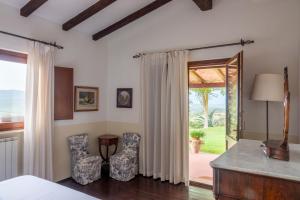 Ένα ή περισσότερα κρεβάτια σε δωμάτιο στο Podere Cavone - Casale degli Ulivi +27 φωτογραφίες