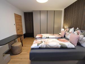 Ένα ή περισσότερα κρεβάτια σε δωμάτιο στο Bruggerheim