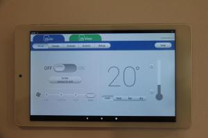 an ipod screen with a website on it at Oceans 21 Caves Beach in Caves Beach