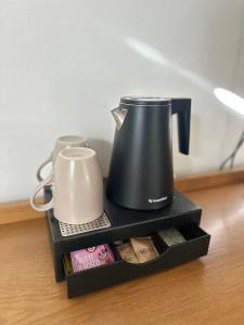 Tetera y cafetera en Hotel Ferrari