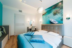 Ένα ή περισσότερα κρεβάτια σε δωμάτιο στο inQse Wroclaw Centre +32 φωτογραφίες