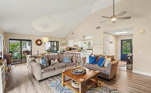 a living room with a couch and a table at 359 Tarpon Blvd in Fripp Island
