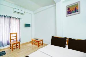 Un televizor și/sau centru de divertisment la Hotel O Assam Inn Grand +21 fotografii