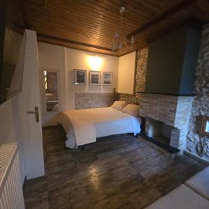 Postel nebo postele na pokoji v ubytování Κτήμα Βασίληγιάννη