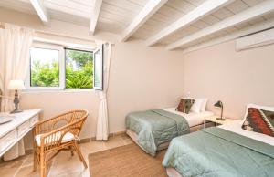 En eller flere senge i et værelse på Myrtle Cottage + 28 billeder