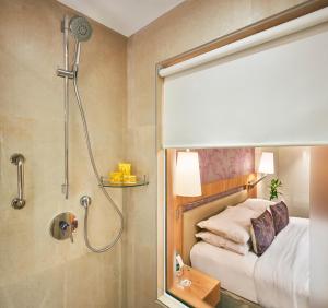 Postel nebo postele na pokoji v ubytování Hotel Bawa International