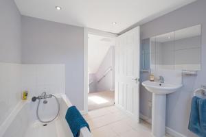 a bathroom with a tub and a sink and a shower at Charming 2 bed in Aberchirder in Aberchirder