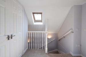 a stairway with a window and a skylight at Charming 2 bed in Aberchirder in Aberchirder