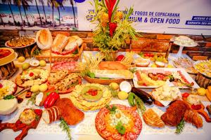 a table filled with lots of different types of food at Mirante do Arvrao in Rio de Janeiro +52 photos