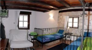 Postel nebo postele na pokoji v ubytování Albergue Rural Montebaserria