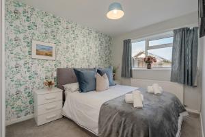 En eller flere senge i et værelse på Moorland Bungalow Central Clitheroe