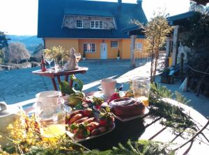 a tray of food on a table in front of a house at Casa Quercus Galicia, a 17 minutos de Santiago! in A Estrada