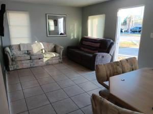 a living room with a couch and a table at GpL 3115 A Family Get Away in Fort Myers