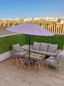 Фотография из галереи Appartement chic a 5 mins de la plage в городе Эль-Хархура