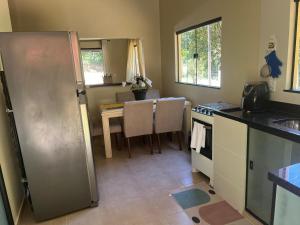 Kuchyň nebo kuchyňský kout v ubytování Sítio com rio e muito verde! + 7 fotografií