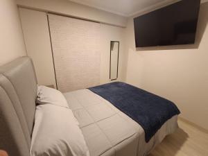 Кровать или кровати в номере Comfortable apartment in Parque la Reserva