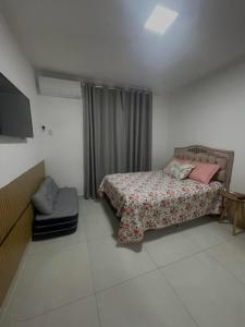 Postel nebo postele na pokoji v ubytování Alpes de Vinhedo + 11 fotografií