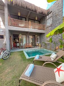 une villa avec piscine et une maison dans l'établissement Zami 03 & 04, à Porto de Pedras