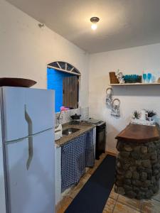 Køkken eller tekøkken på Chale a 80 metros da praia de Maresias