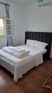 Ένα ή περισσότερα κρεβάτια σε δωμάτιο στο Casa de férias de Jamal em Chimoio