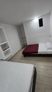 Giường trong phòng chung tại Hospedaje La Escondida