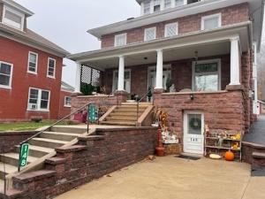 a brick house with a staircase in front of it at Pet Friendly 2BR • King+Queen • Full Kitchen in Adamstown