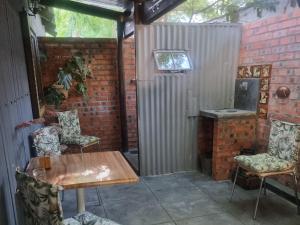 Et tv og/eller underholdning på Koekeloer Selfcatering Cottages